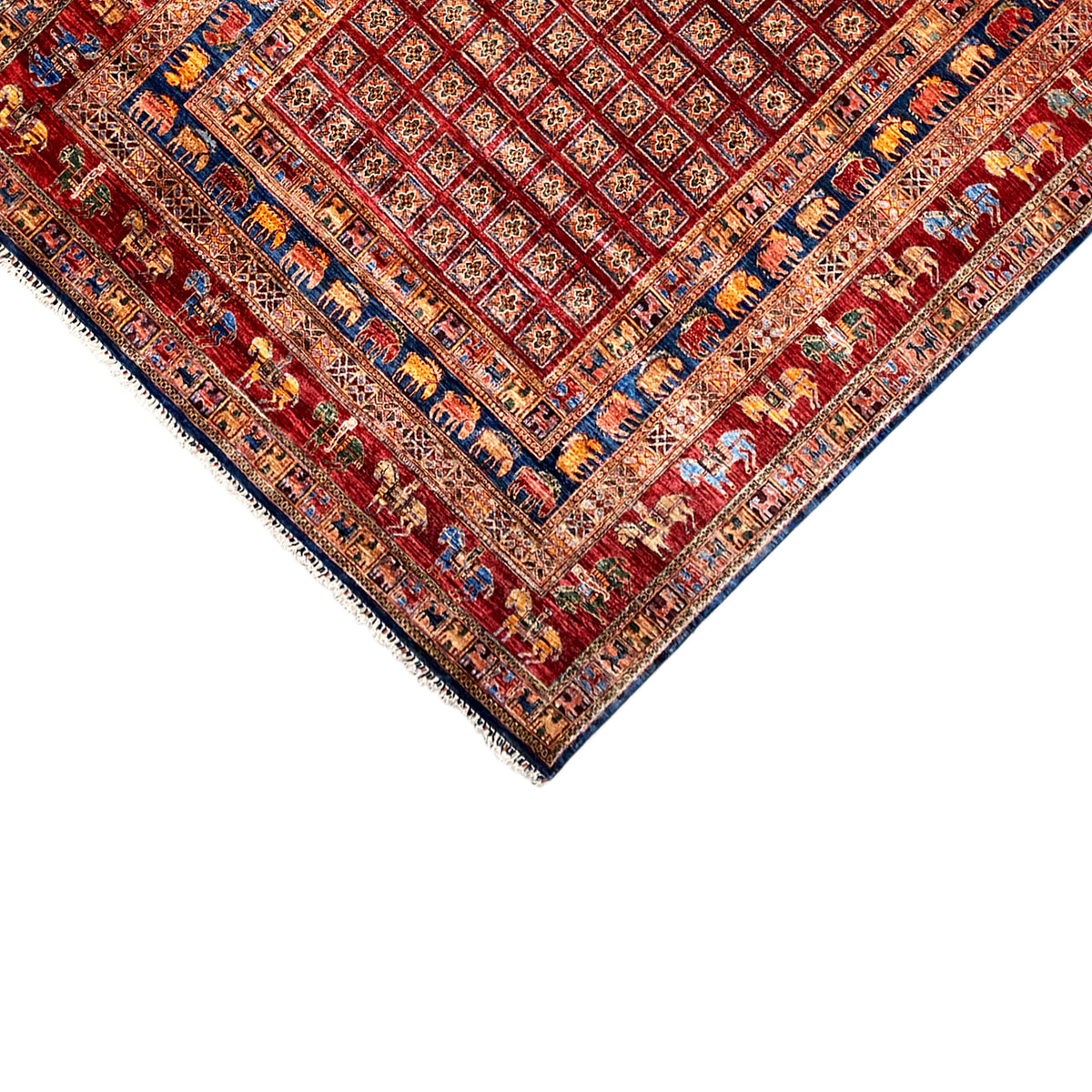 Corner detail: red-blue patterned areas with a fine border and white fringes