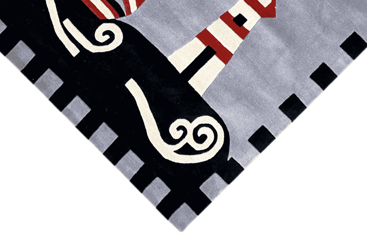 Children's sailing boat rug, corner view: sailing boat and lighthouse in a black-and-white checkered pattern