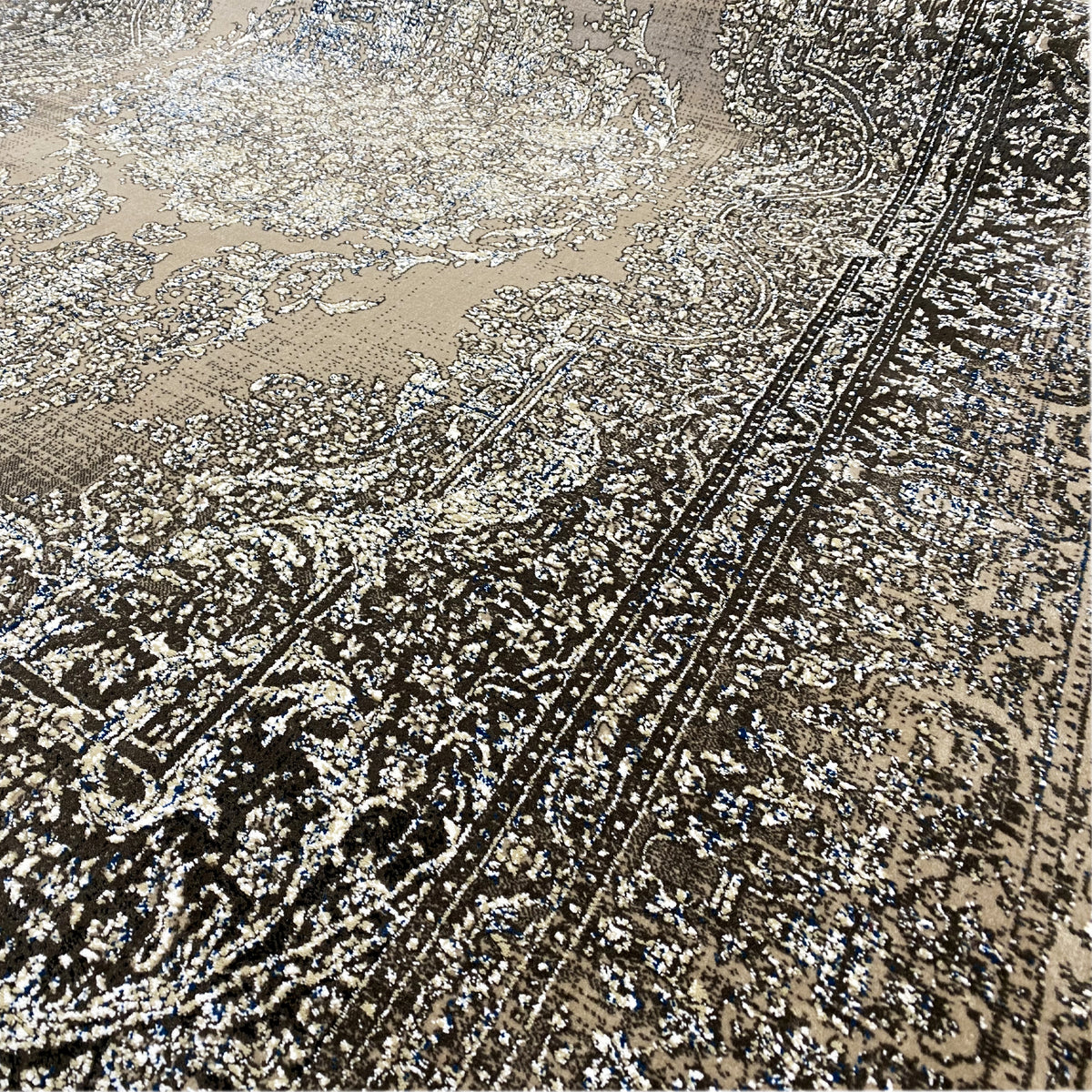 Rug with a large ornamental field in beige, silver and dark brown