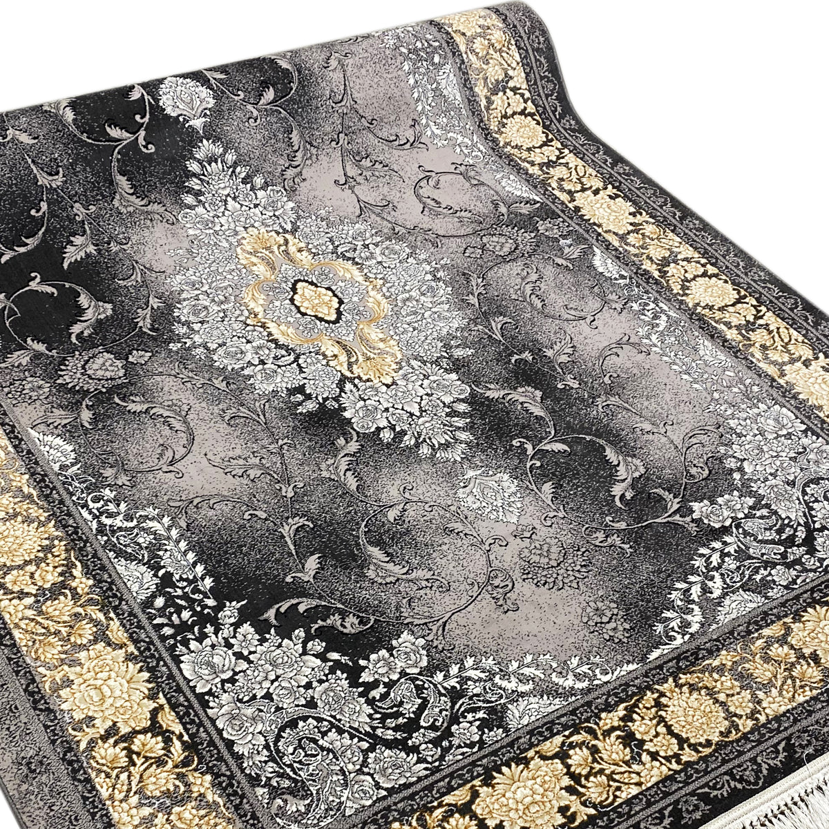 Close-up of a rug with a gray pattern, black outline, and golden floral vignette
