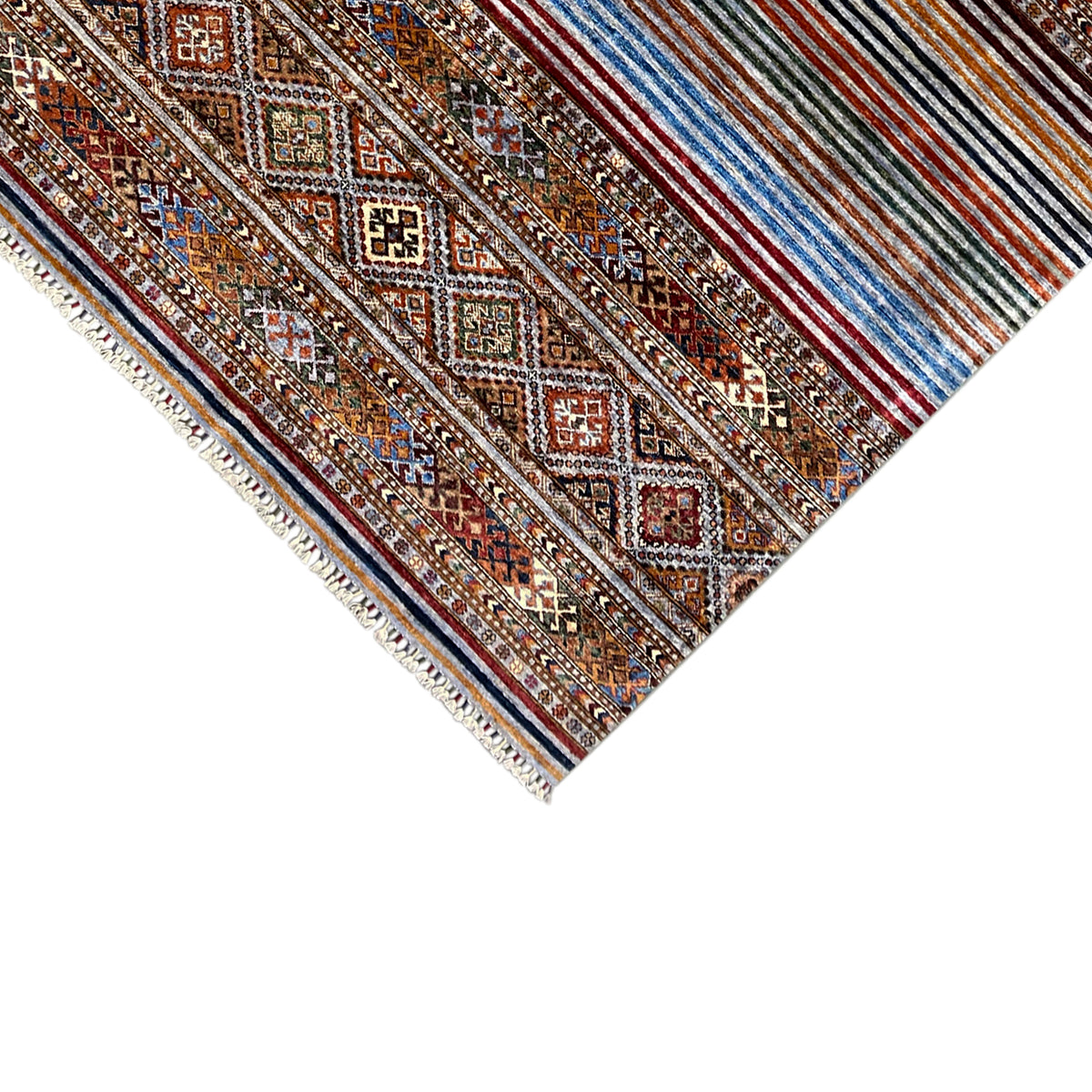 Close-up of the Khorjin carpet: diamond patterns, stripes, and fringes along the edge