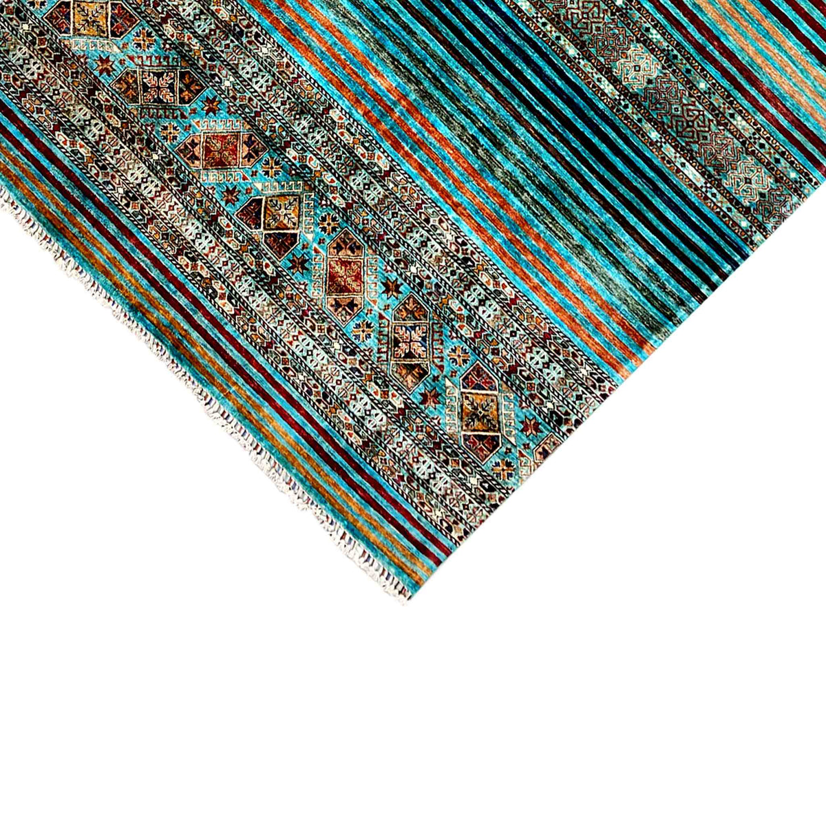 Carpet corner with turquoise stripes and ornaments, fringed edging