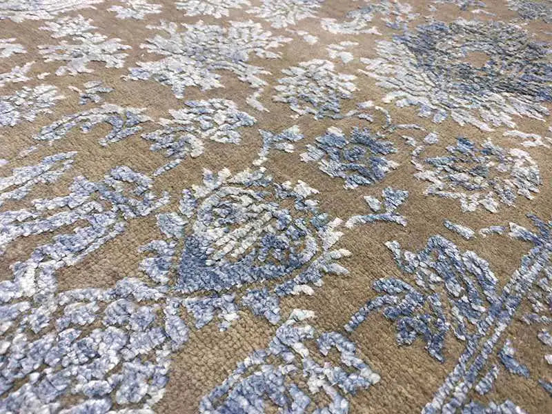 Designer rug, detailed view: ornate pattern in beige and blue-gray
