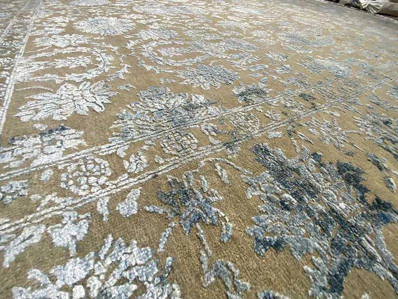 Designer rug pattern detail: ornamental motifs in cream/beige and blue-gray