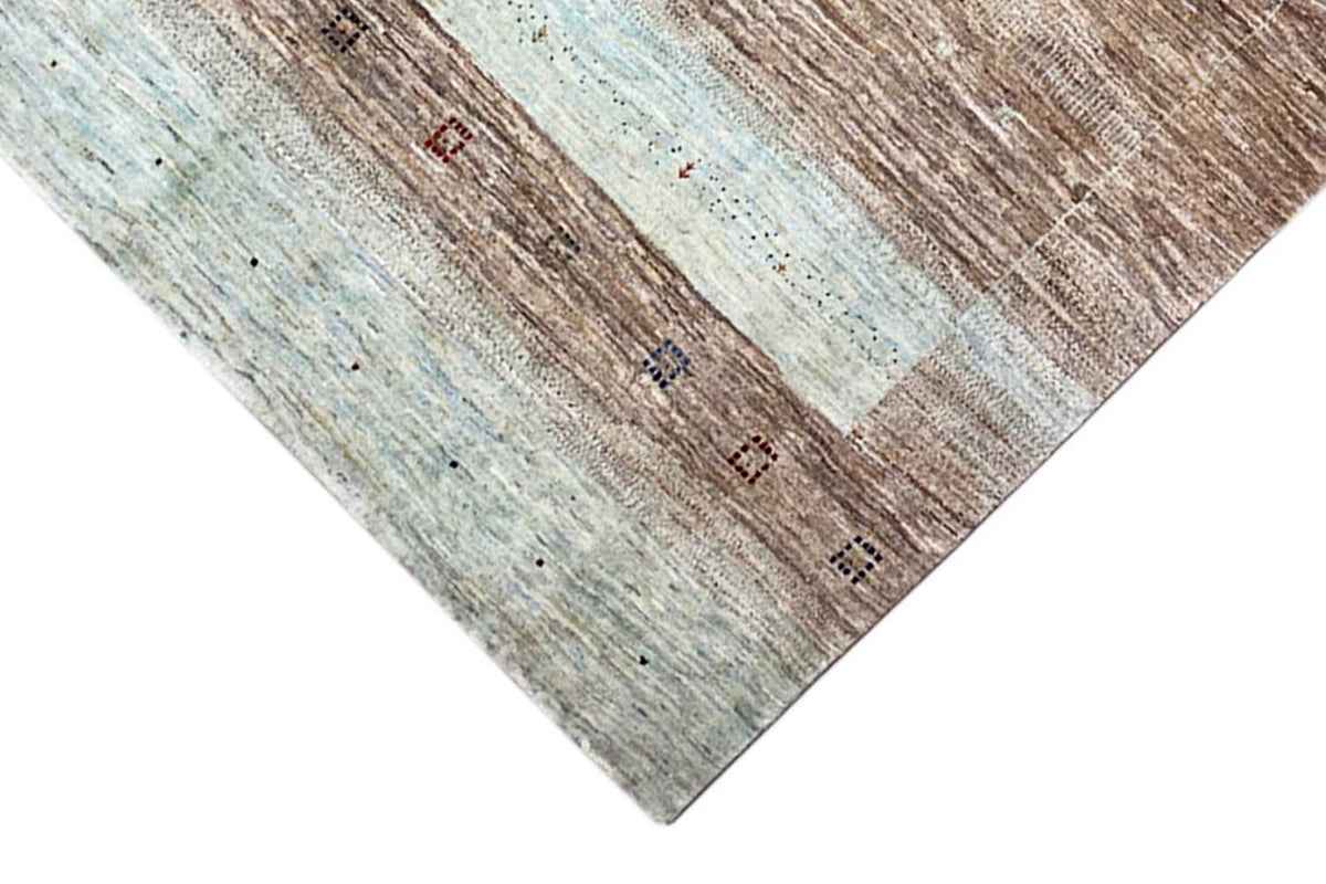 Gabbeh rug - detailed view of the border with small accents of brown and blue