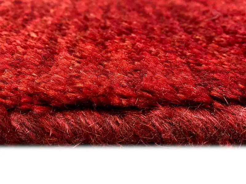 Gabbeh rug, red pile, close-up of the edge and weave structure