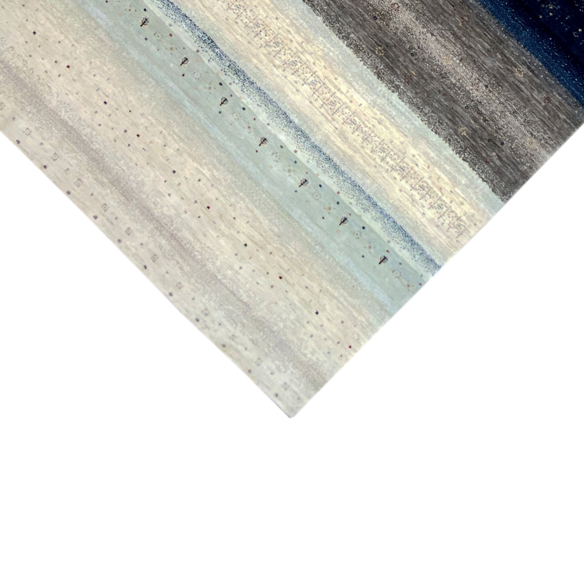 Gabbeh rug corner: light beige with blue-gray stripes and textured dots