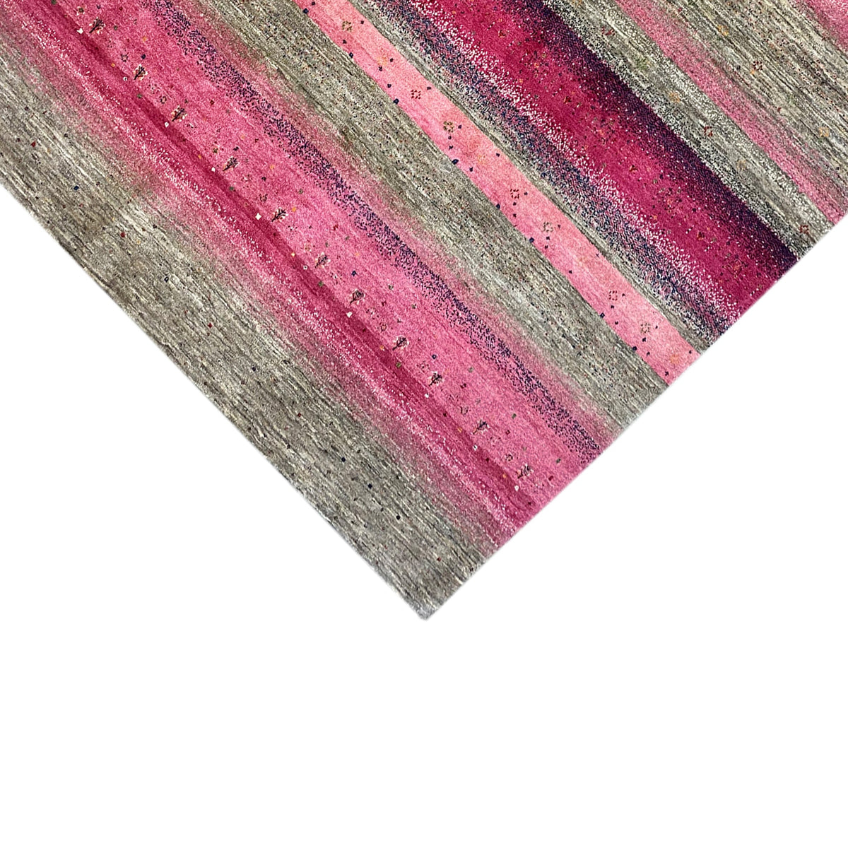Gabbeh rug detail view: horizontal pink and gray stripes, textured and woven