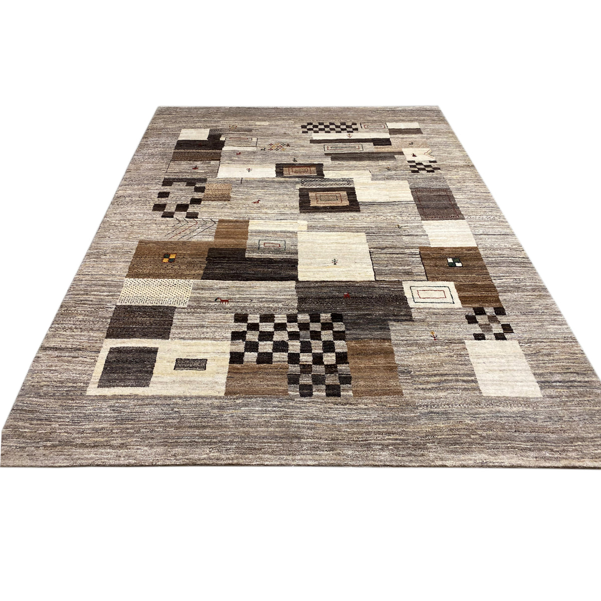 Gabbeh rug with centered patchwork of squares in beige and dark brown