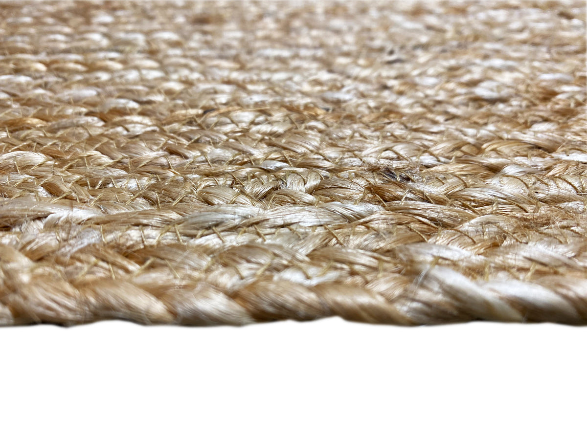 Jute rug fabric in detail: flat fibers with a subtle braided edge