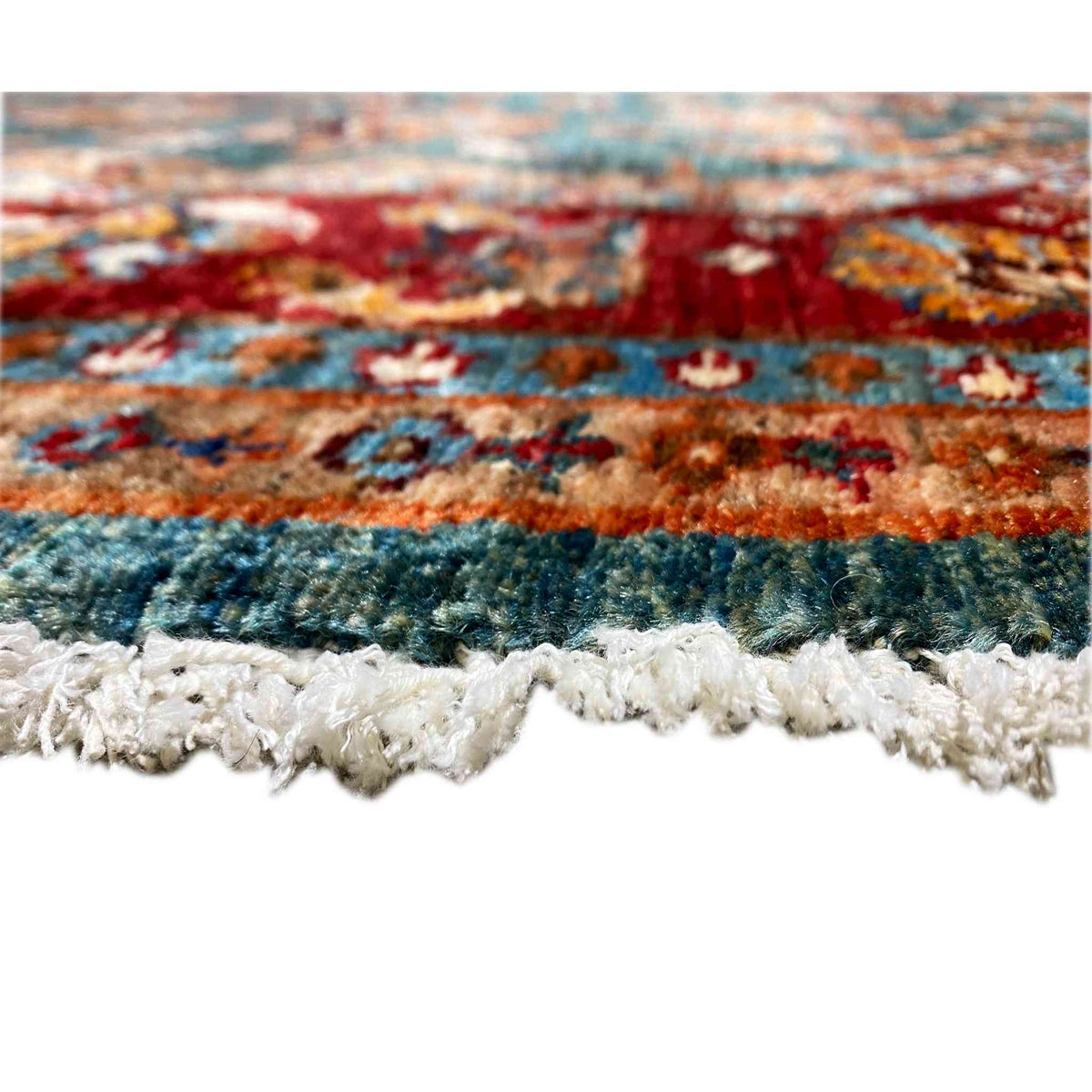 Rug edge with white fringe trim
