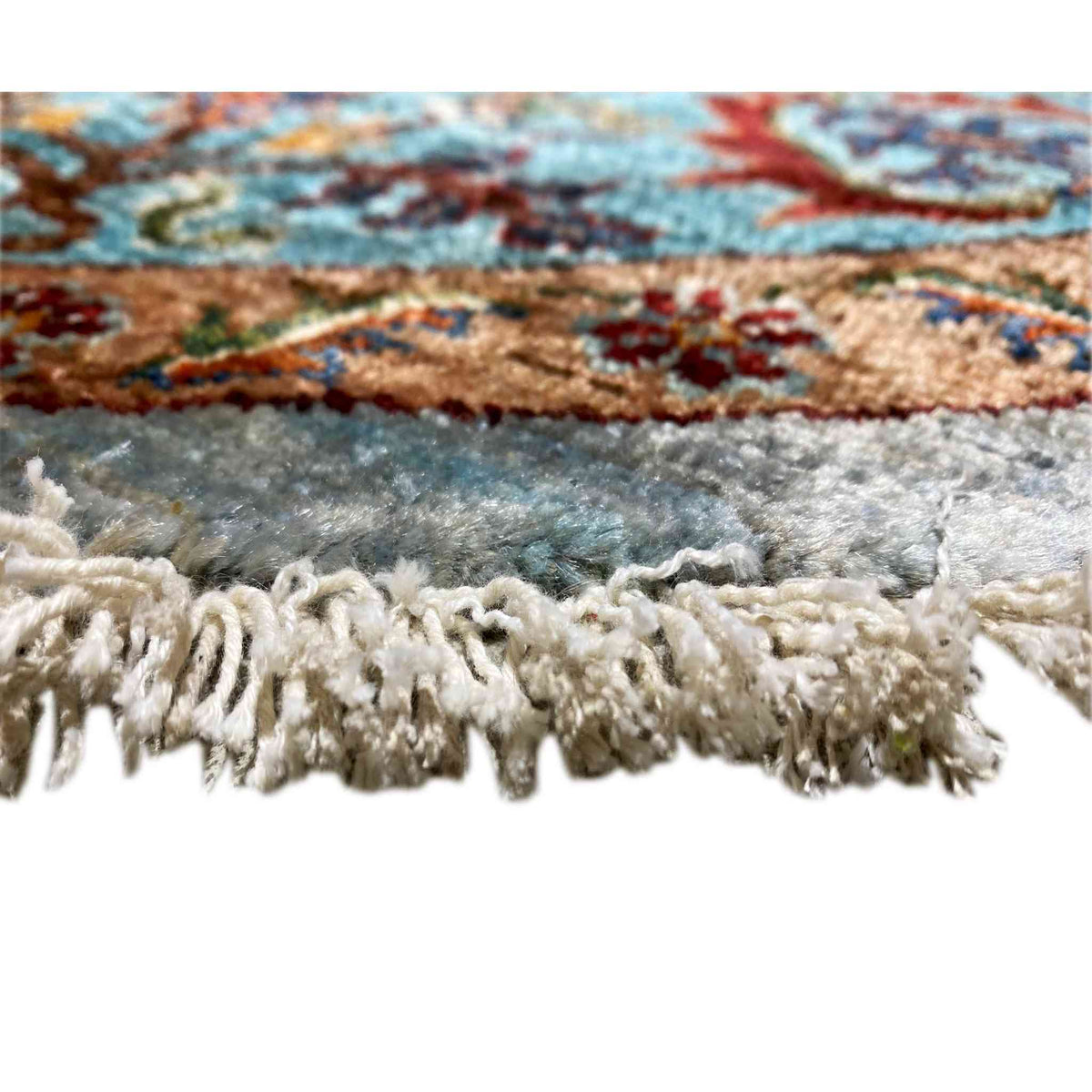 Round wool rug: fringe trim along the edge, gray and cream with a multicolored border pattern