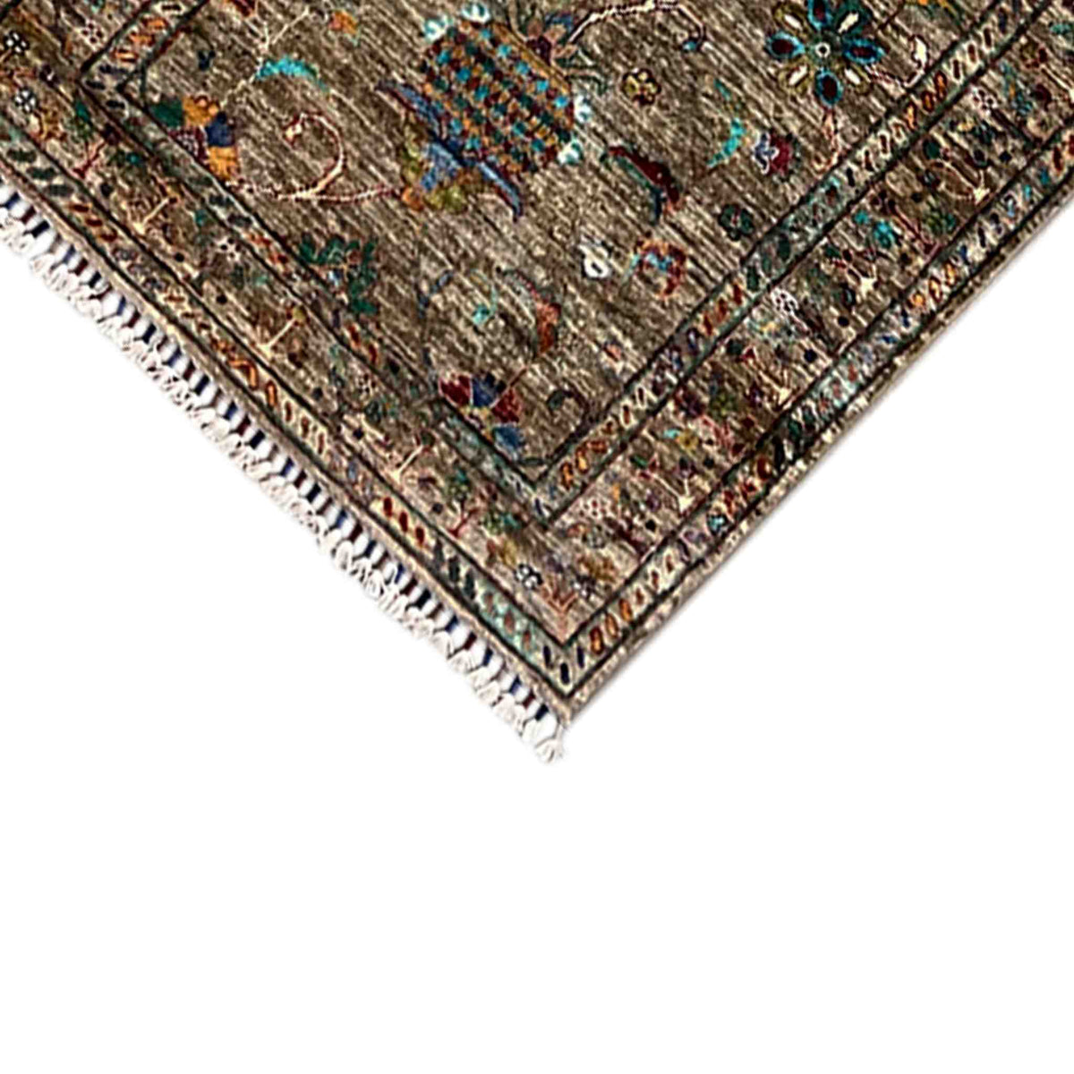 Runner rug corner with colorful motifs and fringes, textured embroidered border