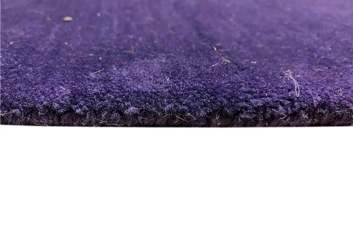 Gabbeh rug 242x169 cm, close-up: purple pile and even fibers
