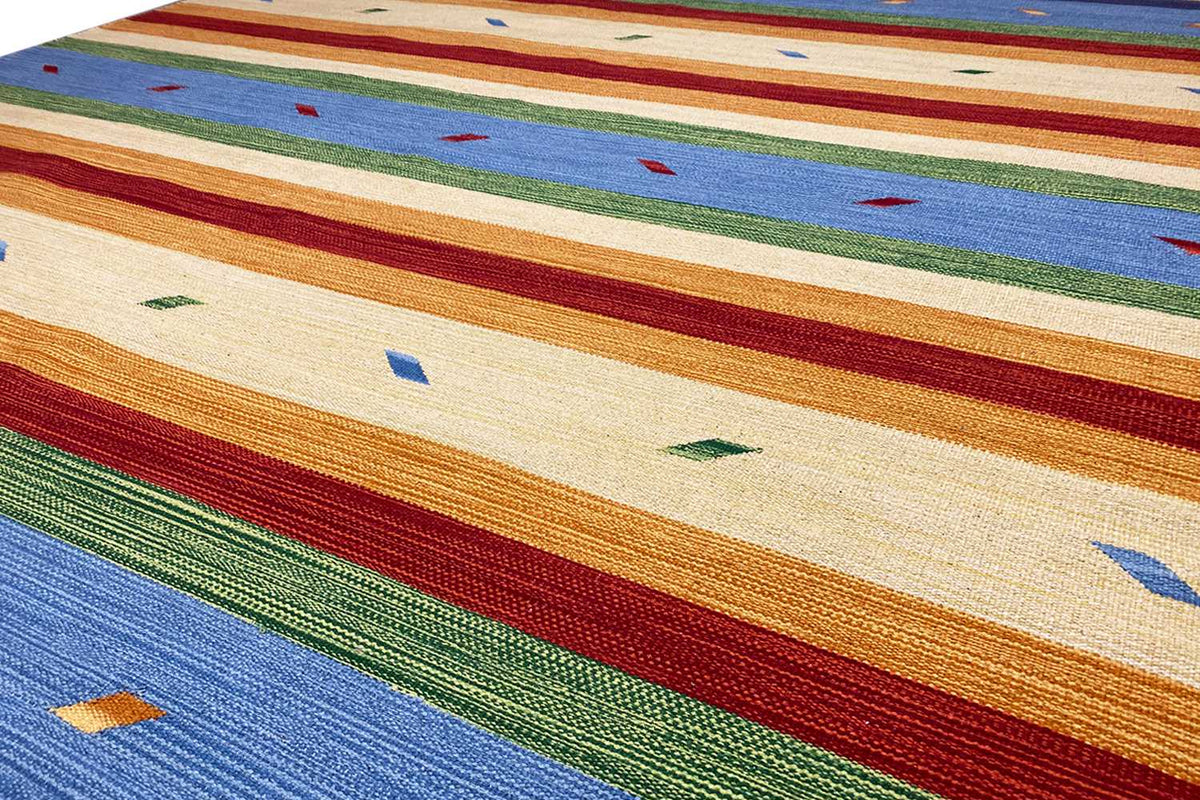 Kilim rug by Samak: colorful stripes with small pattern details, close-up.