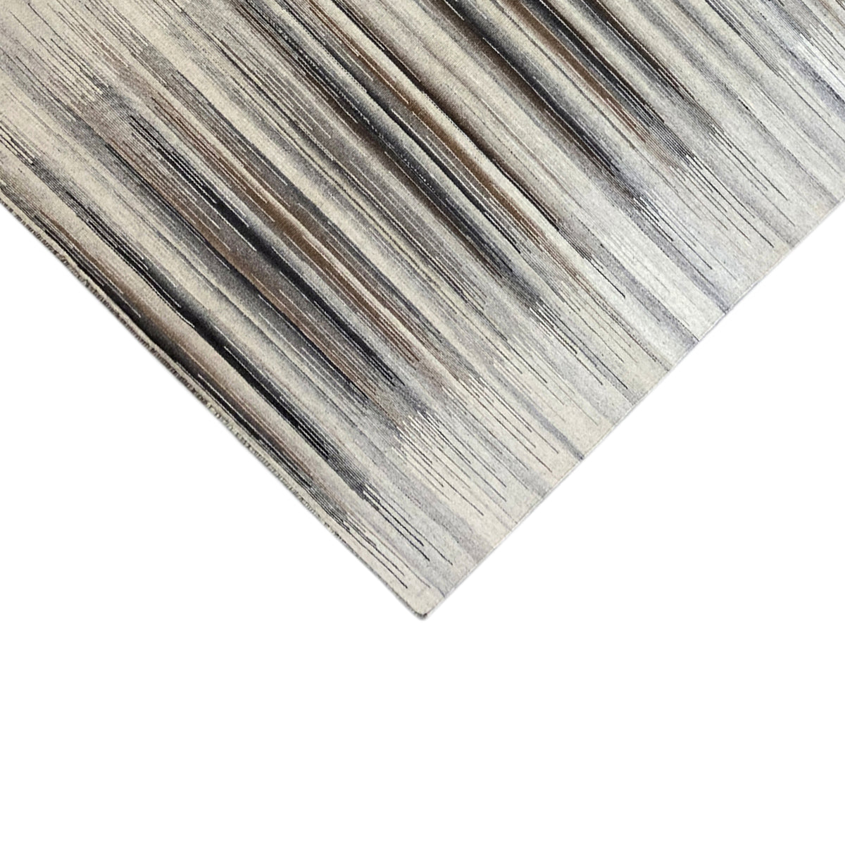 Corner of a kilim dhurrie with dense stripes in gray and beige