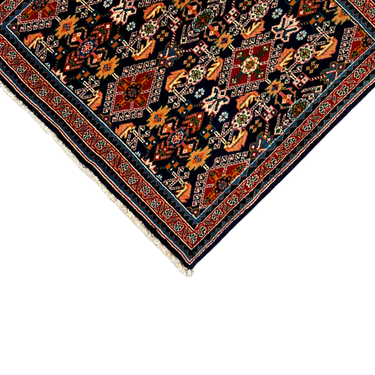 Rug 61x60 cm Detail: dark field with colorful ornaments, white border and fringe.
