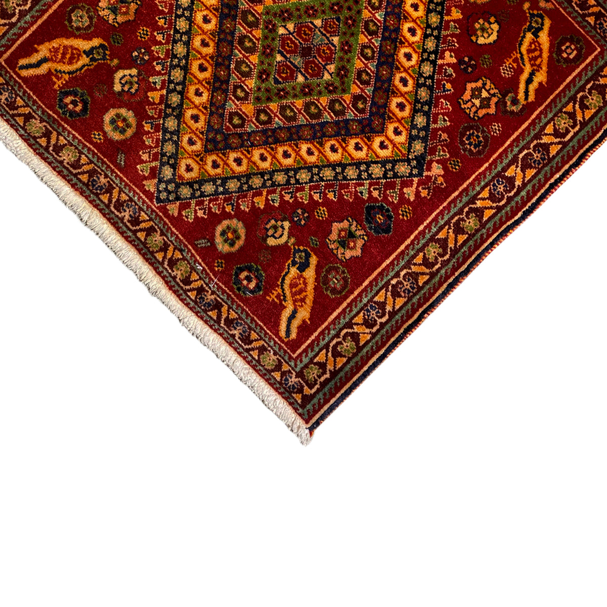 Detail of the Poshti rug, 65x65 cm: lower corner with ornaments and fringed edge