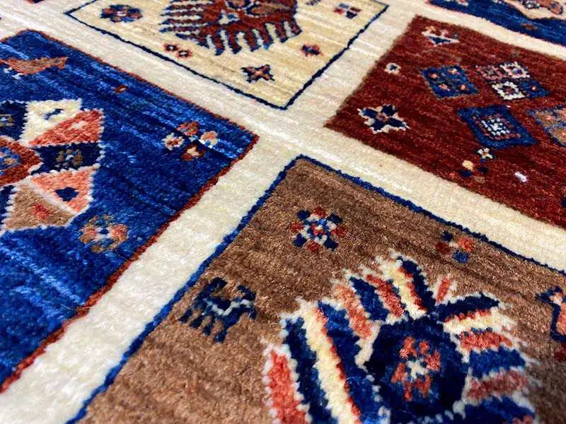 Qashqai exclusive carpet, close-up of various pattern blocks in blue and red