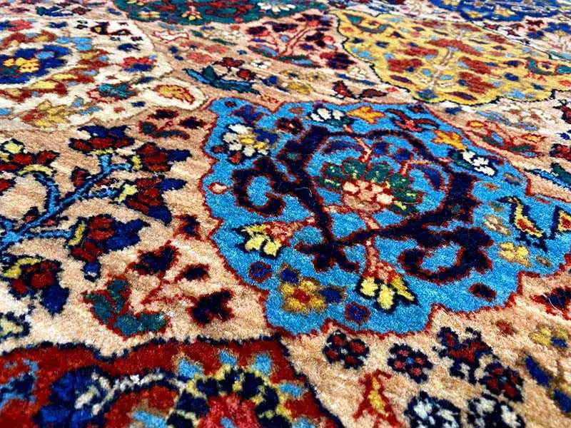 Close-up of a floral ornamental pattern in blue, red, and beige