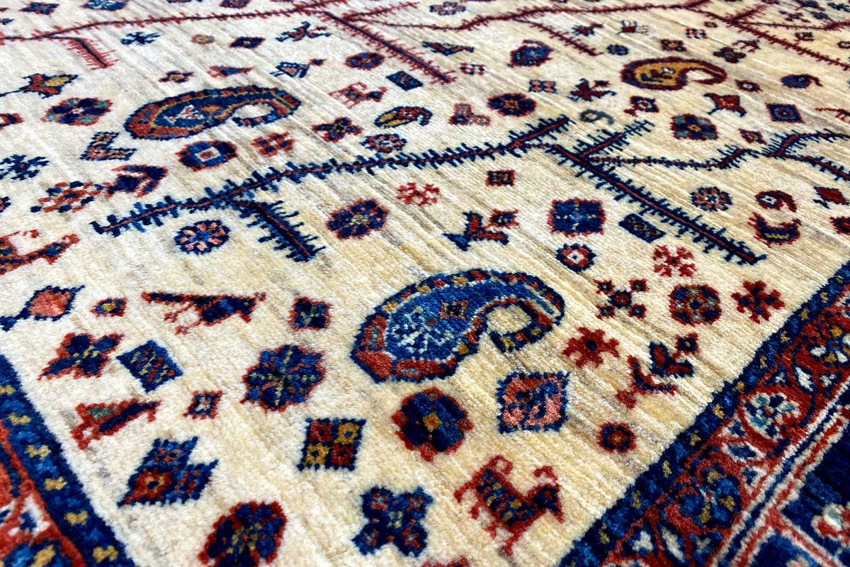 Close-up: Ornamental pattern on a light carpet background with a blue border