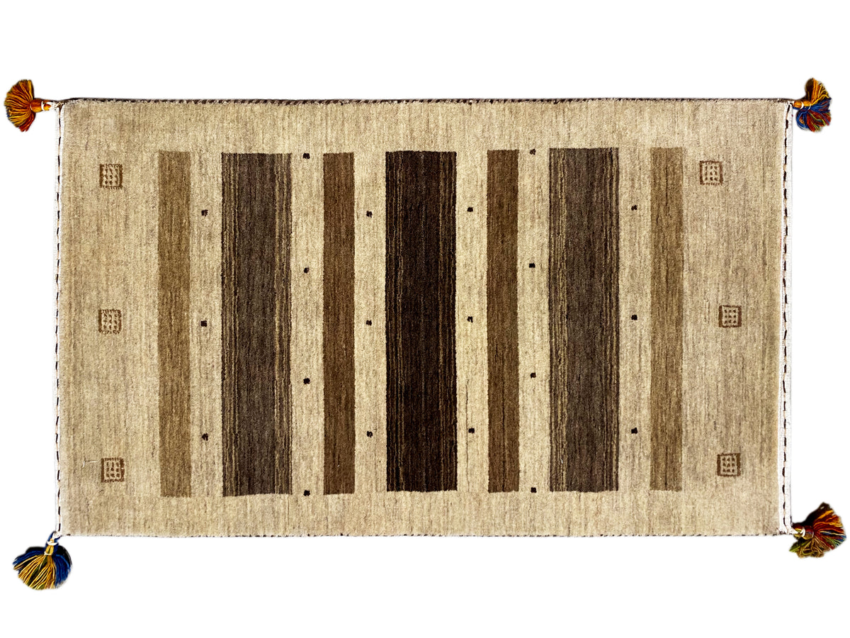 Gabbeh rug 120×68 cm with a beige background, dark vertical stripes, and corner tassels