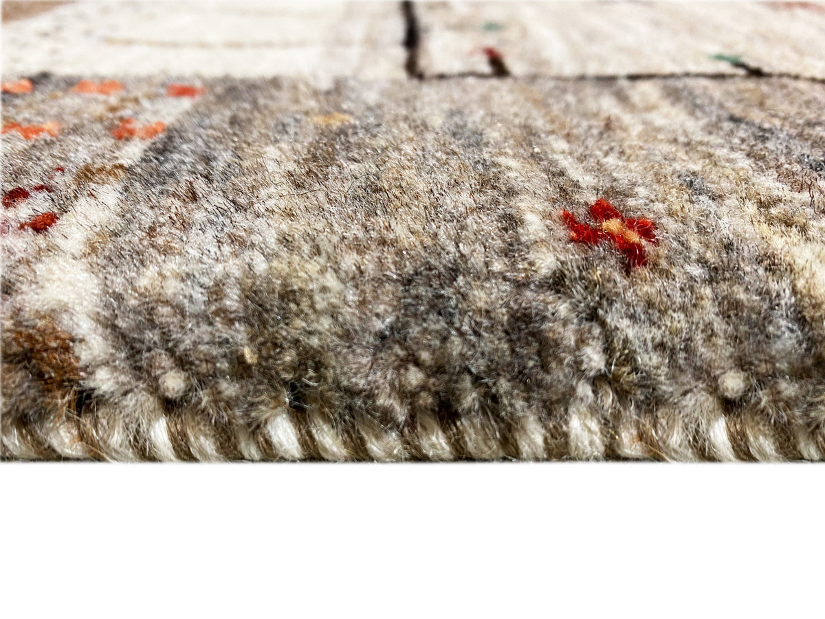 Floral-view Gabbeh runner: dense, mottled pile in beige and dark gray