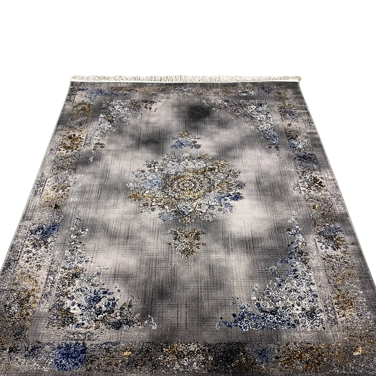 Flat rug with a large central medallion, gray with blue and gold ornaments, bordered edge