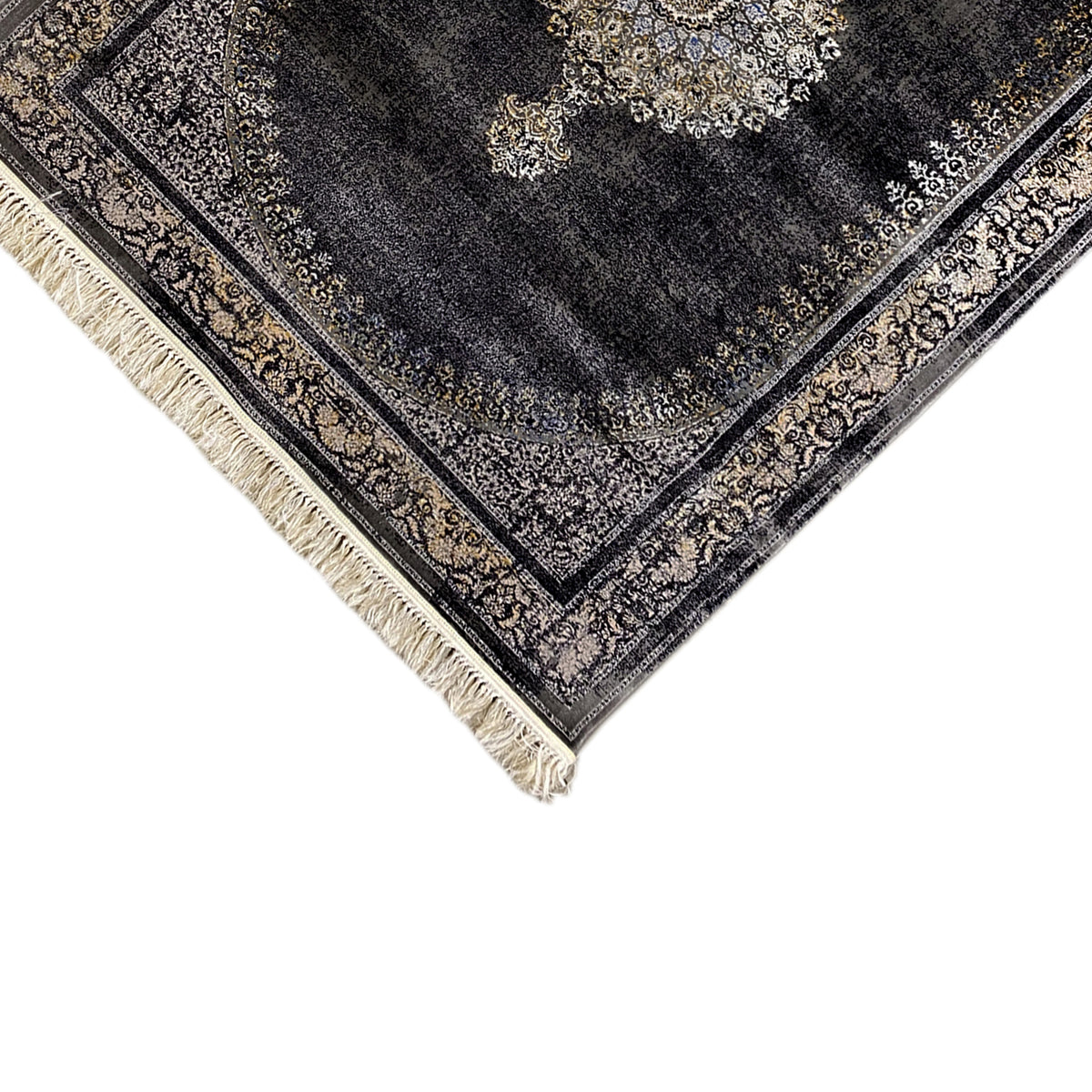 Corner view of dark gray medallion rug with border and beige fringe