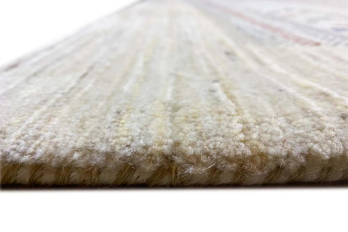 Close-up of a Gabbeh rug: dense pile with a beige, mottled appearance