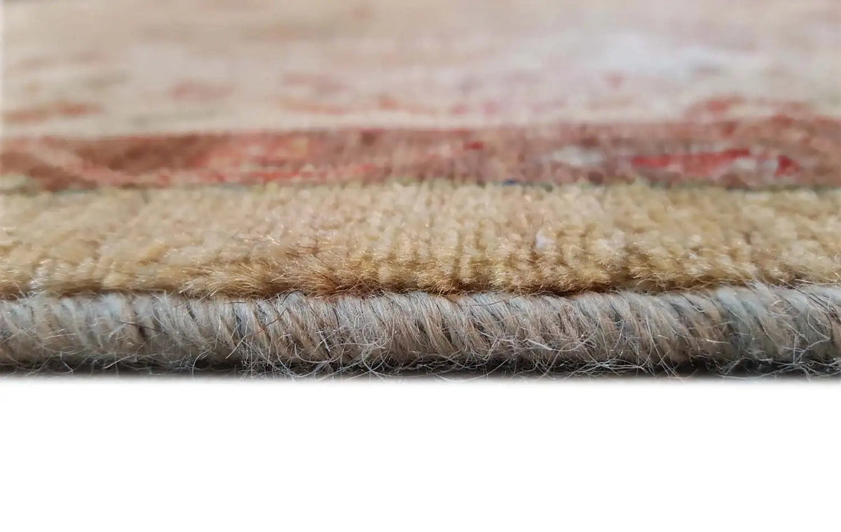 Rug edge in detail with pile and underside, beige and reddish edging strip