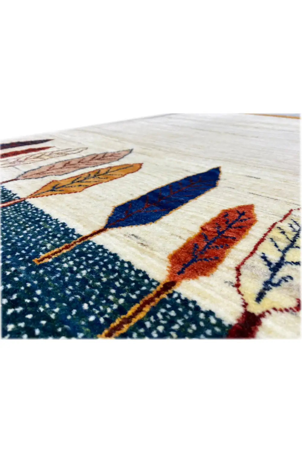 Rug corner detail: tree and leaf motifs on a light background, colored border