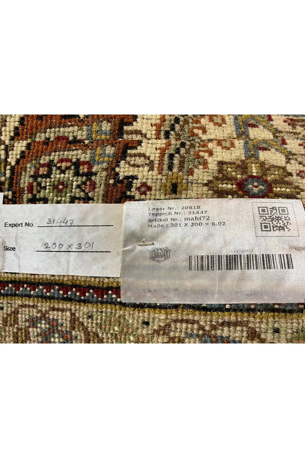 Rug with attached label, side stripes, and patterned background