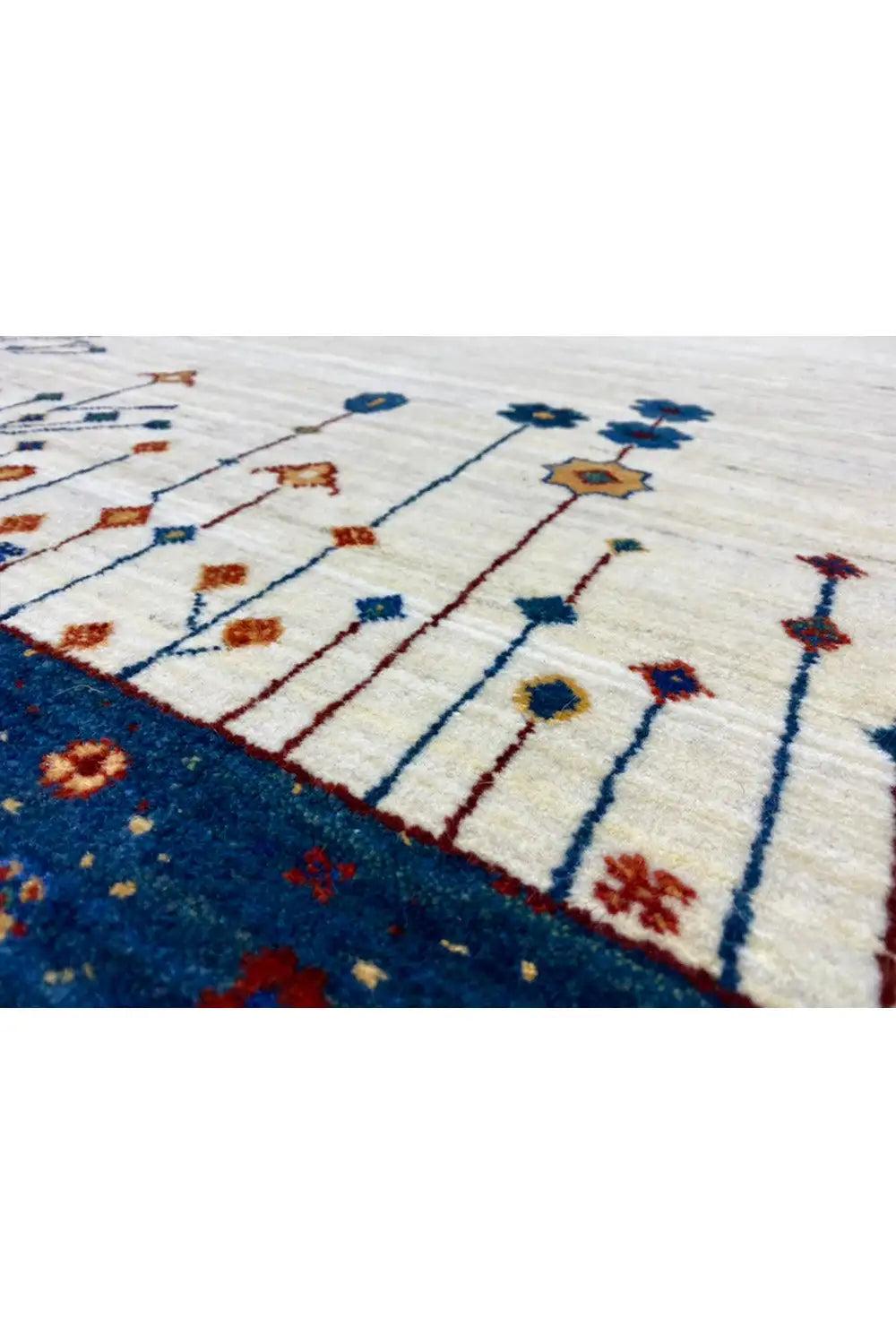 Gabbeh rug 123x77 cm close-up of the pattern: vine lines in blue, red, and gold tones