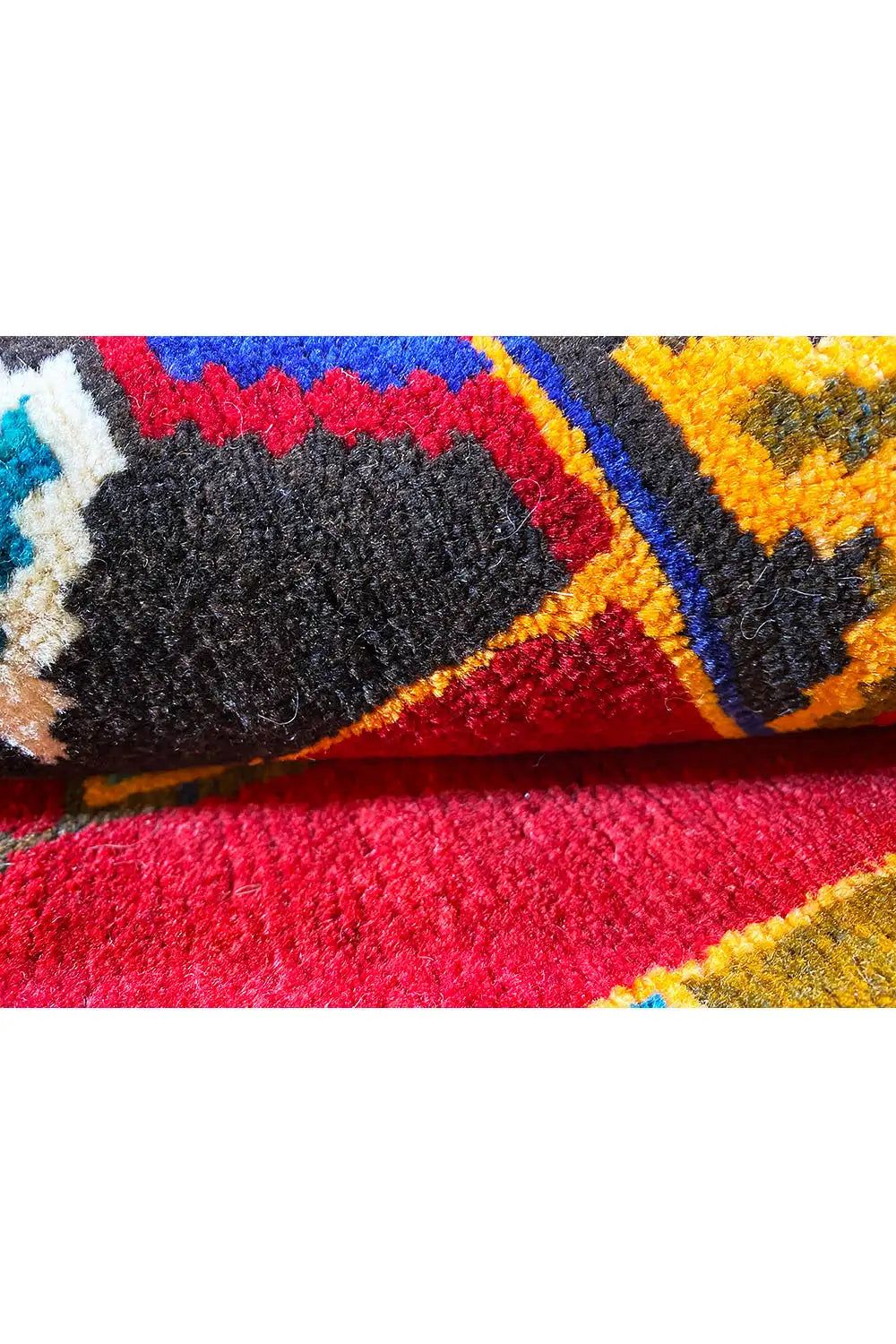 Carpet in detail: colorful border patterns, bound edges, short pile fibers