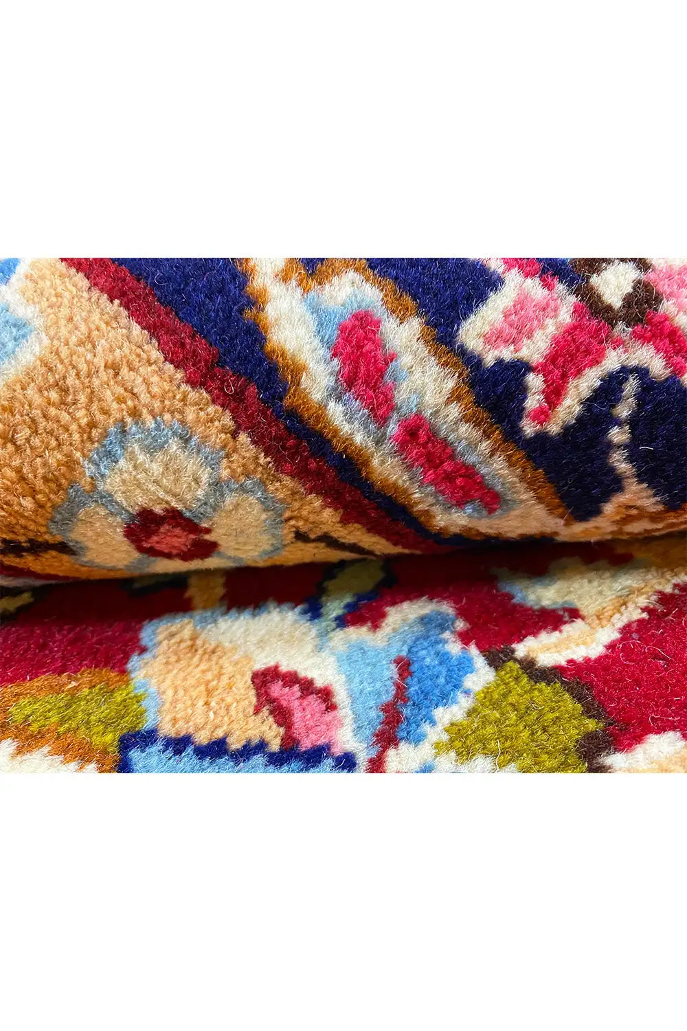 Kerman rug with multicolored pile texture, close-up of a pattern detail