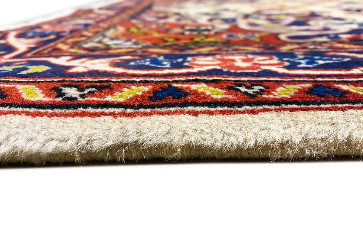 Rug edge with short fringes and a multicolored border design, light background