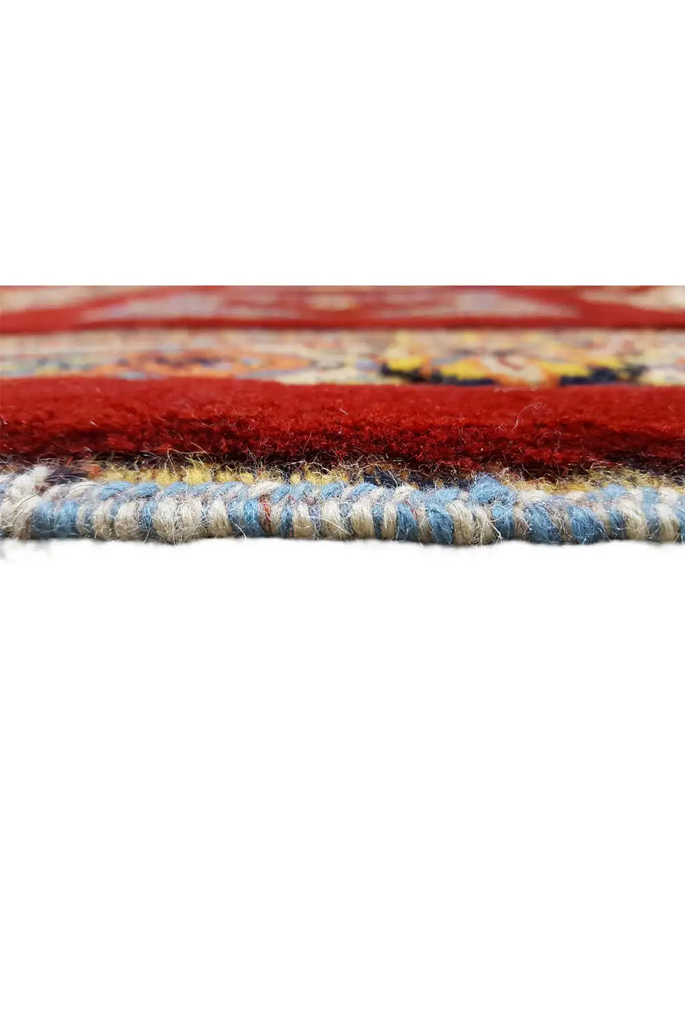 Carpet edge with red padding and multicolored braided edges