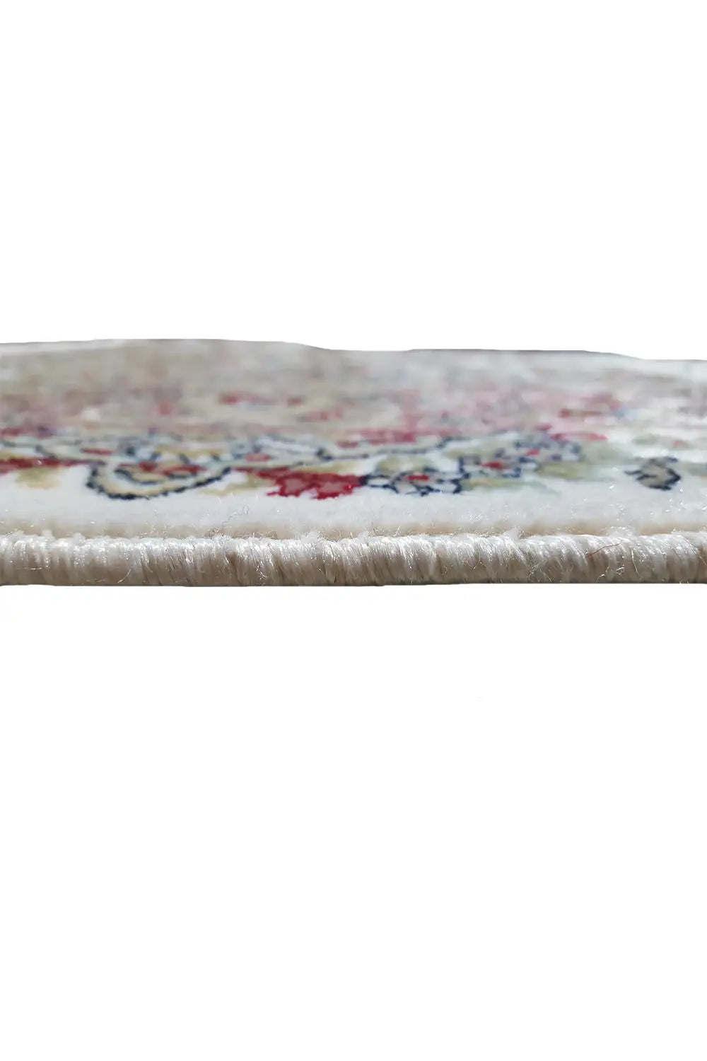 Close-up of the rug edge with fringe and a multicolored pattern