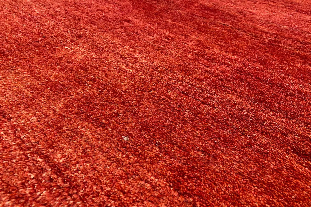 Gabbeh rug, close-up of the red mottled weave texture