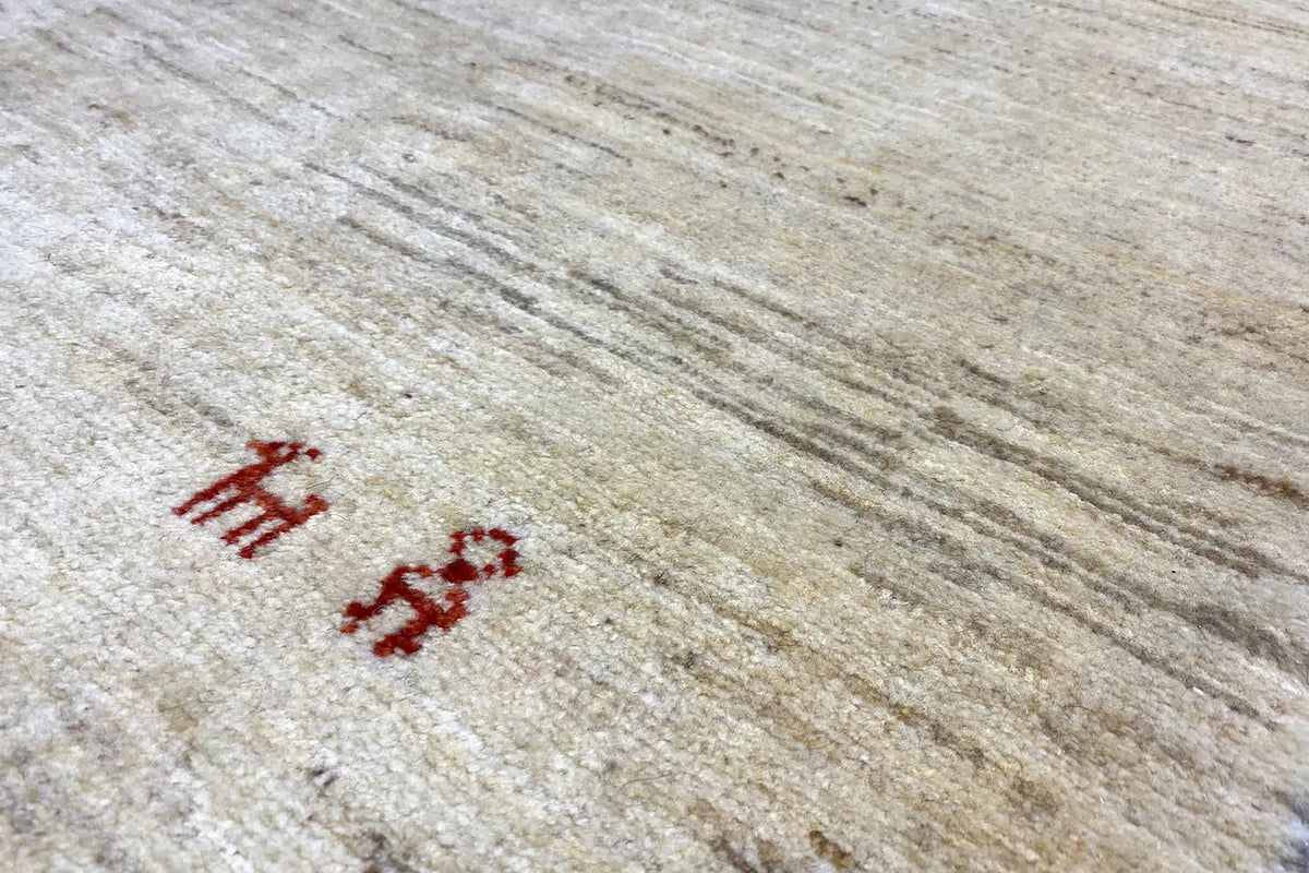 Close-up: beige carpet with a red pattern of symbols