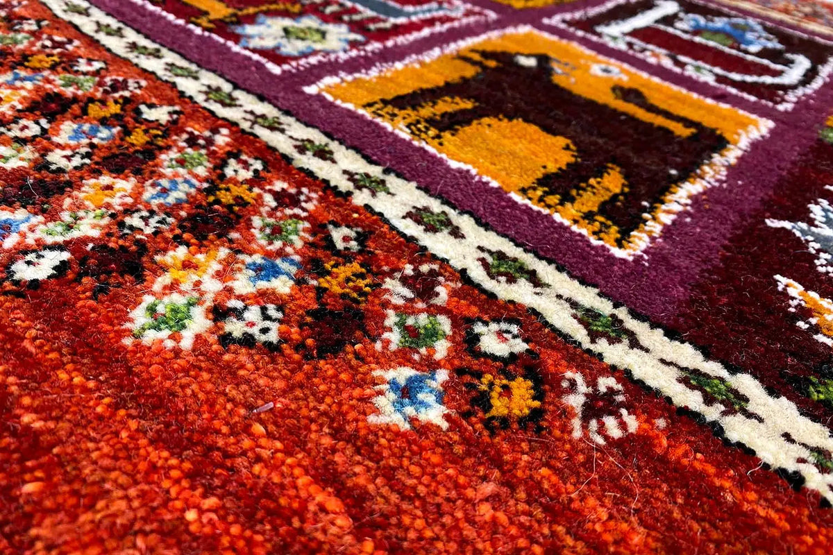 Gabbeh-Lori rug 66x59 cm, detail of the red pile with colorful floral ornaments