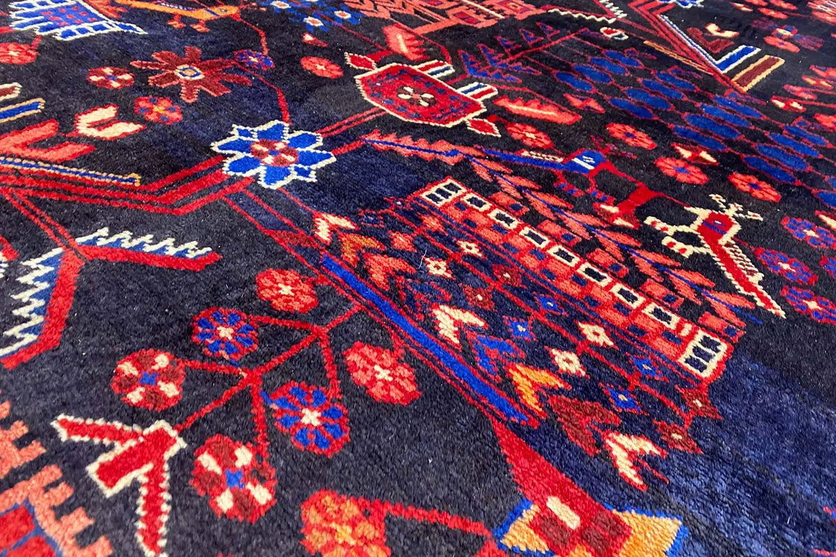 Close-up: dark blue runner with a red, blue, and white ornamental pattern