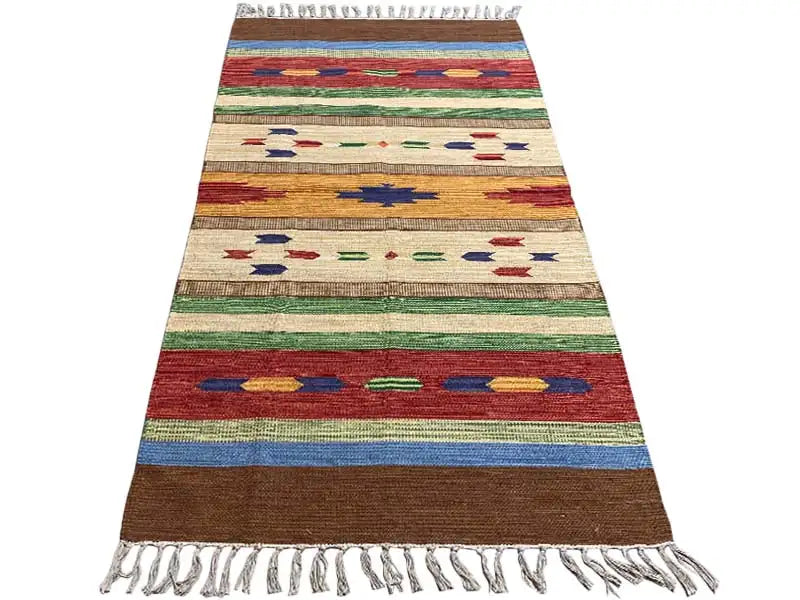 Kilim with colorful horizontal stripes and geometric symbols, fringe