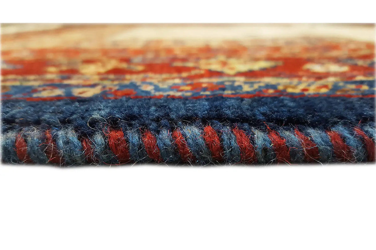 Carpet edge with a blue fringe finish and red-and-blue pattern