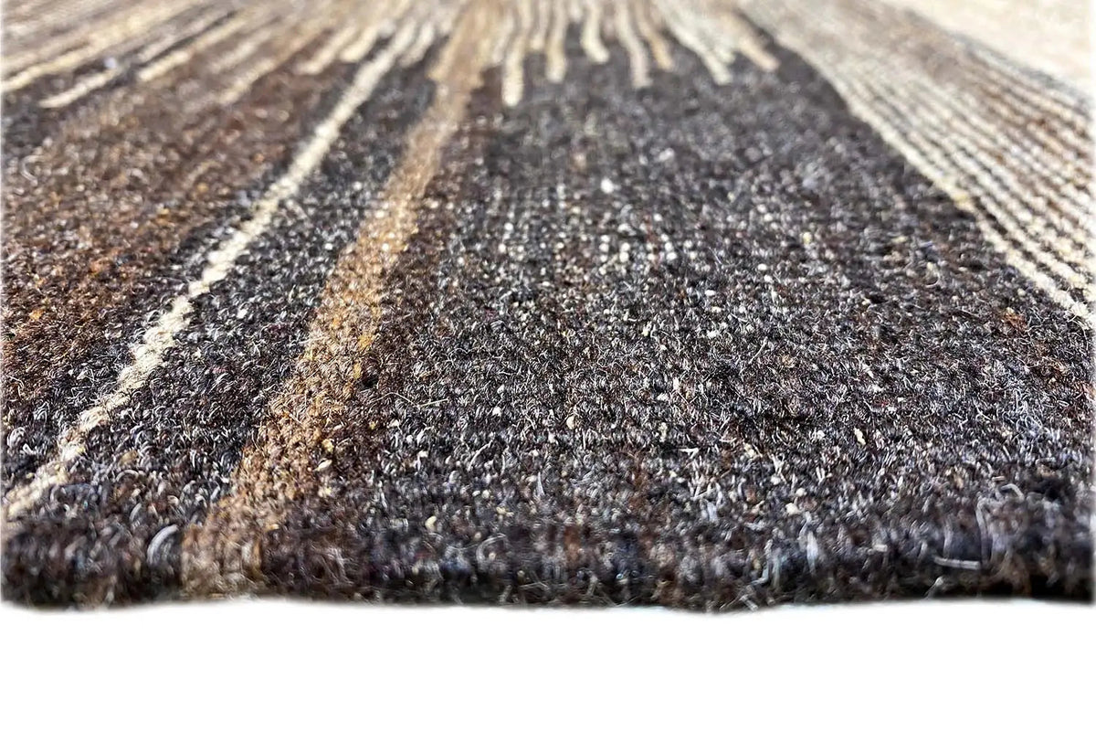Close-up of a kilim rug with a dense texture and lengthwise stripes.