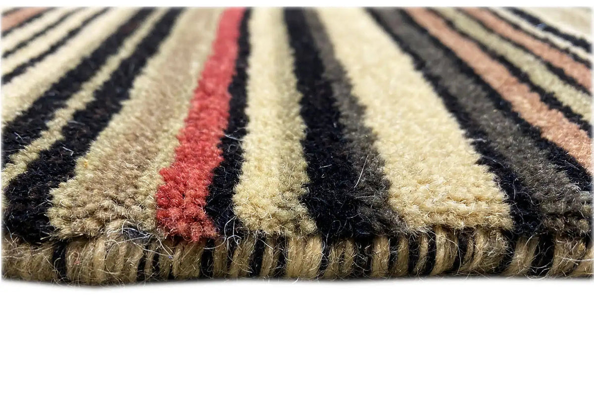 Gabbeh rug with fringes and stripes, detail of the selvedge