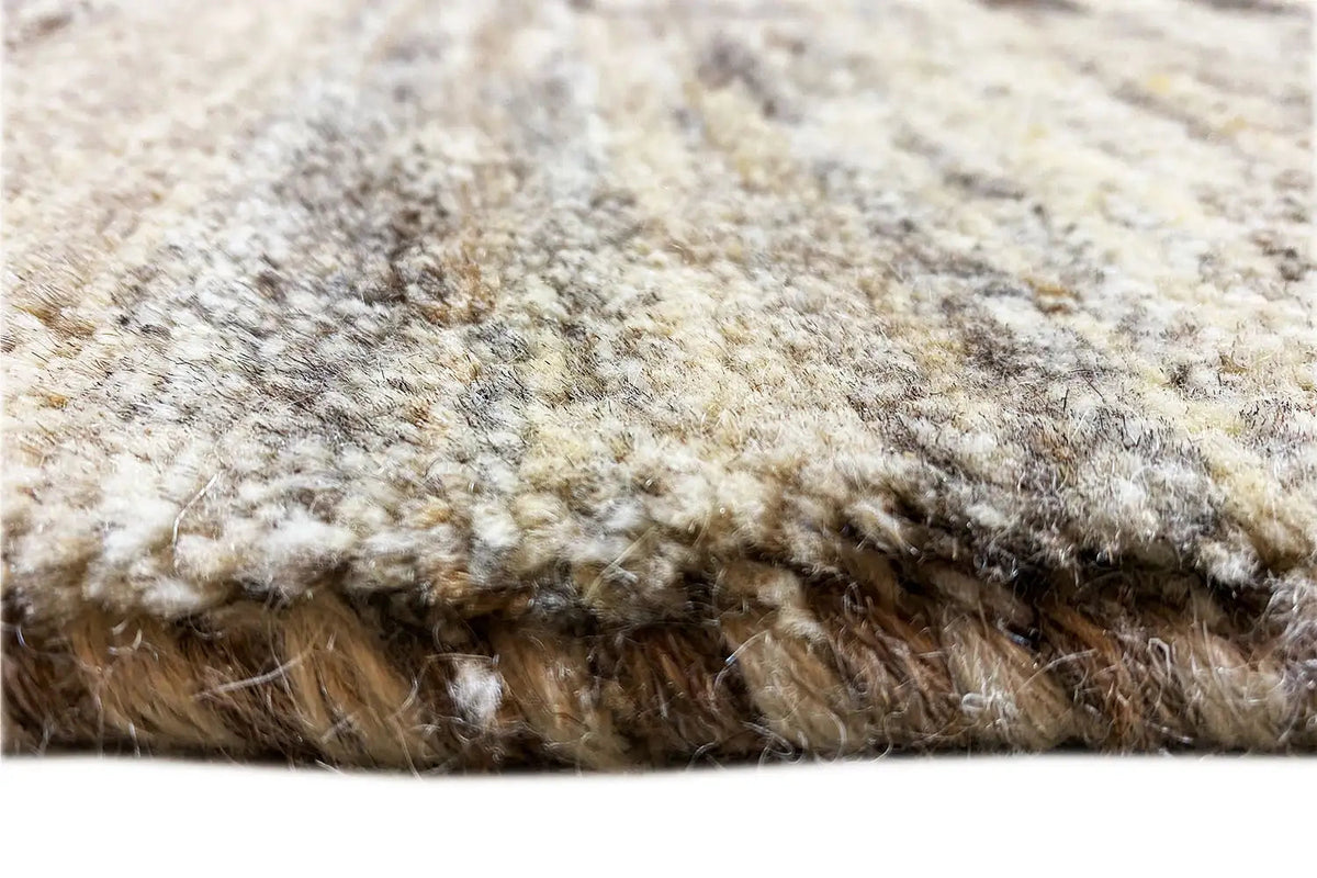 Gabbeh rug 200x151 cm: close-up of the pile edge with short brown fringes