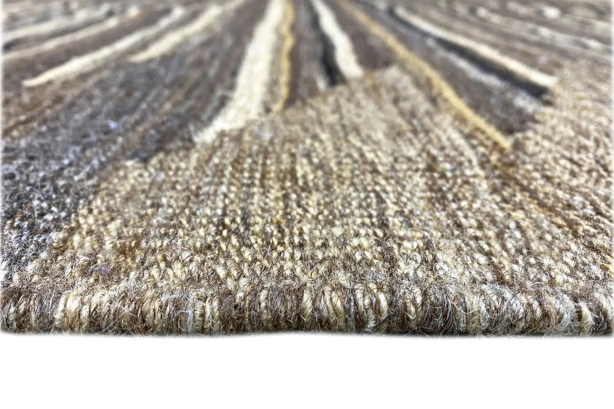 Rug pile with a coarse woven texture in shades of brown and beige