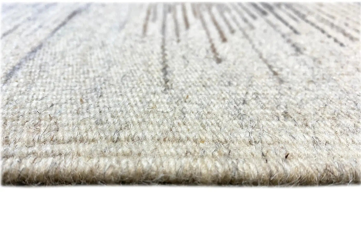 Dhurrie rug edge detail: flat-woven border with a light-colored pile